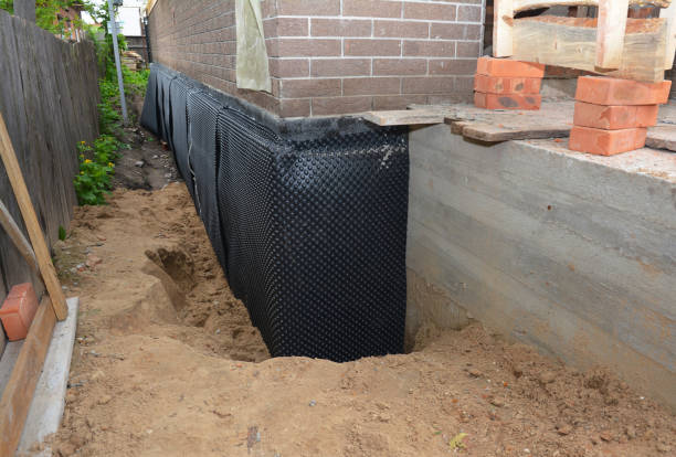 Happy homeowners after waterproofing job in Crownsville